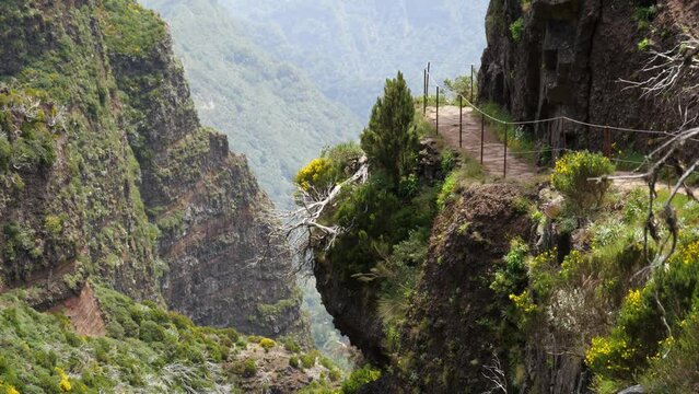 Beautiful scenery of trail on mountain in Levada Do Caldeirao Verde hiking area in Madeira, Portugal