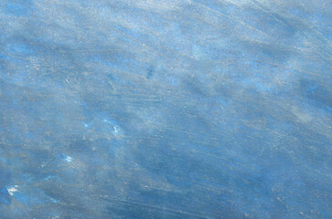 
art background of blue stains with a metallic effect
