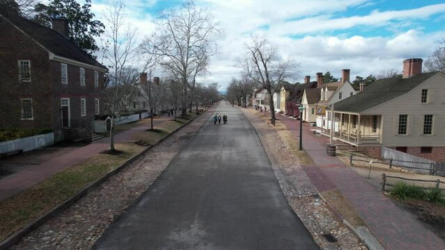 Drone footage of a street with old architecture buildings in Colonial Williamsburg in, Virginia, USA