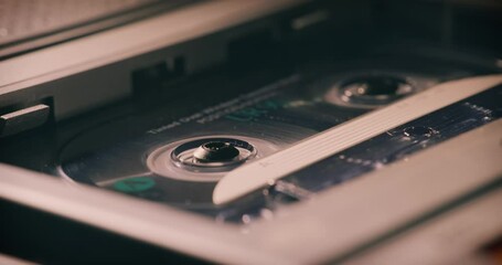 Audio Cassette Tape Turning in Stereo - Close Up