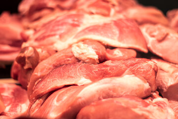Animal product, raw meat, pork or beef, sits on the table