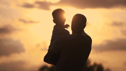 Father care is important kid toddler for a healthy family. happy family kid concept. The silhouette...