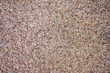 a wall that has many different types of gravel on it