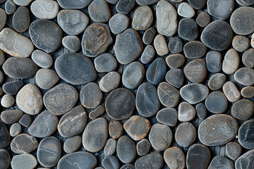 Smooth black pebbles pattern, creating a seamless, natural design perfect for zen, calming decorations and spa-inspired textiles