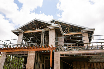 timber framed two storey house under construction