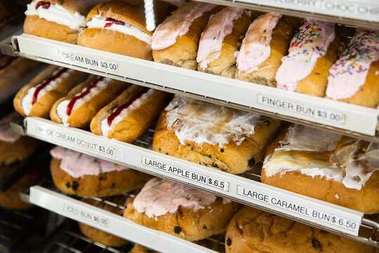 assorted sweet treats for sale in a bakery display case
