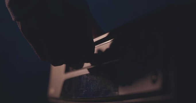 Playing a VHS tape in a VCR video recorder