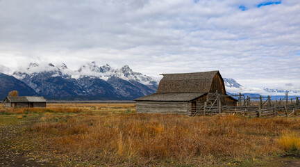 Aged barn in a wide field in Grand Tetons National Park