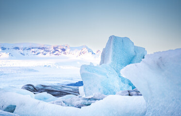 The ground is covered with ice with blue snow flakes