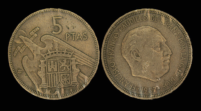 Close-up of a Spanish peseta coin against a black background