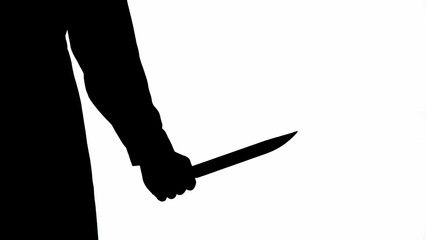 Black silhouette of a male maniac with a large sharp knife in his hand. Unrecognizable man on white isolated background.