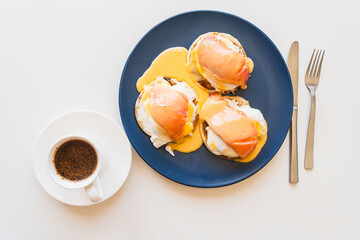 Toast with salmon, poached egg, cream cheese and Goland sauce. Bruschetta with poached egg and...