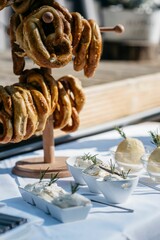 Close-up of pastries and dips on plates