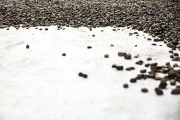 a fleece is rolled out onto which pebbles or river gravel are then poured as drainage