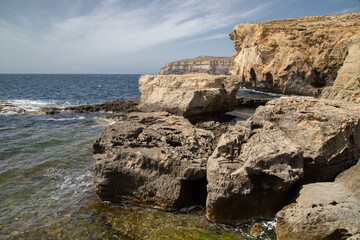 Beautiful shot of stunning rocky landscape surrounding Dwejra Bay, Malta