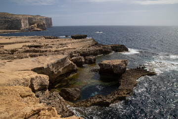Beautiful shot of stunning rocky landscape surrounding Dwejra Bay, Malta
