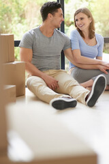 Couple, boxes and moving to new home, mortgage and property success or investment home loan....