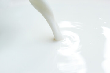 Close up of pouring white milk