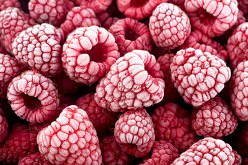 Berries background - frozen raspberries covered with hoarfrost. Summer berries, view from above.