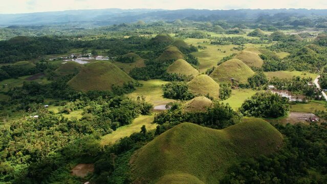 Lush landscape of the Chocolate Hills, Bohol, Philippine. Drone view of green valley with iconic geological mounds. Concept of wanderlust, travel for Asia