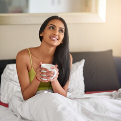 Indian woman, home and smile in bed with coffee for wake up in morning and memories. Female person,...