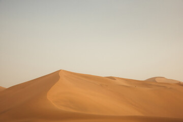 Mingsha Mountain and Crescent Lake in Dunhuang, Gansu Province - Desert scenery under clear sky