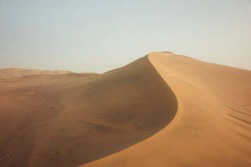 Mingsha Mountain and Crescent Lake in Dunhuang, Gansu Province - Desert scenery under clear sky