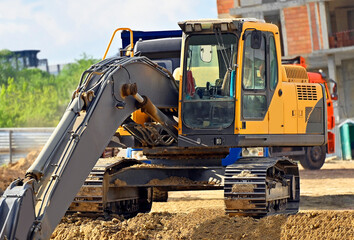 Excavator working with soil