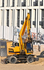 Excavator working with soil