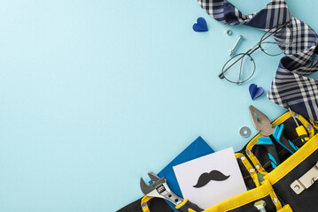 A creative Father's day setup with various tools in a yellow bag, stylish tie, glasses, and heart...
