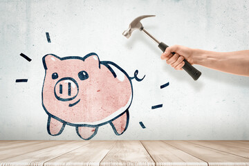 Piggy bank drawing with a hammer about to strike