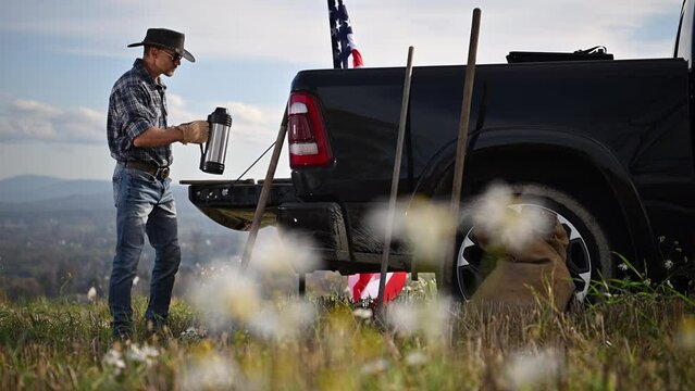 Man Talking on Cell Phone in Truck Bed