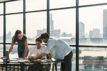 Group of professional business team brainstorming marketing idea.Young beautiful manager looking at...