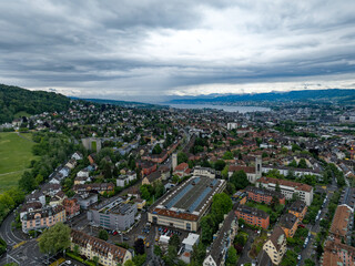 Obraz premium Aerial view of Swiss City of Zürich with cityscape and skyline with Lake Zürich in the background on a cloudy spring day. Photo taken May 17th, 2024, Zurich, Switzerland.