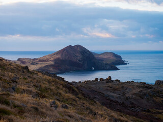 Views of Canical at Cape Ponta de Sao Lourenco, Canical, East coast of Madeira Island, Portugal. Scenic landscape of Atlantic Ocean, rocks and cllifs and cloudy sunrise sky.