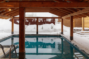 Winter outdoor swimming pool under a canopy: a world of calm and harmony
