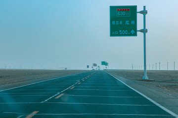 Jiuquan City, Gansu Province - Desert power towers, roads and Gobi scenery