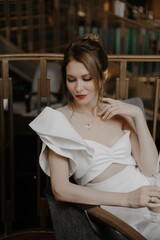 A young couple in wedding looks posing in a stylish loft bar.