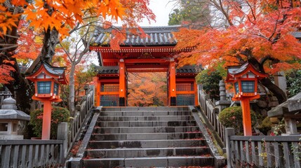 A serene image of a Japanese shrine framed by vibrant autumn leaves, with stone steps leading up to a red torii gate and lanterns