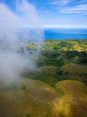 Teletubbies Hill, Nusa Penida, Bali, Indonesia, Beautiful small green hills with clouds, Ariel view of small green hills and clouds