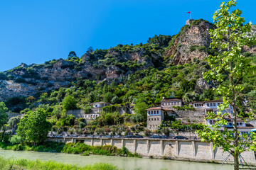 A view across the River Osum towards the Old Quarter and castle in Berat, Albania in summertime