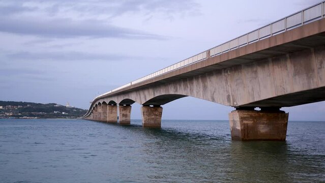 Kouri Big Bridge at sunset Okinawa Island, Japan. Dramatic weather. High quality 4k footage.