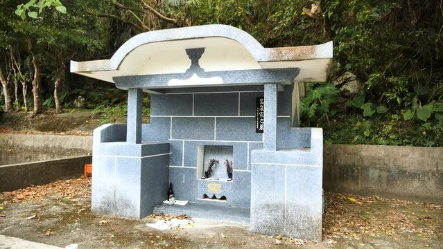 Typical Japanese Cemetery in Okinawa Islands, Japan. The peculiarly shaped Okinawan tombs known as kamekoubaka. The traditional Okinawan turtleback tomb. High quality 4k footage