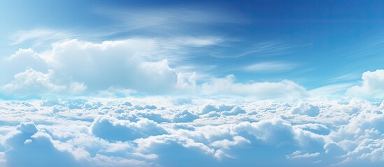 The sky showcases a breathtaking panorama with large dramatic clouds that exude the power and beauty of nature This captivating landscape provides ample copy space for additional elements