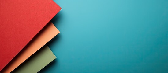 Horizontal copy space image featuring a colorful background of red green and blue toned cardboards