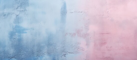 The wall has a gradient texture with light pink and blue colors The rough surface is textured with visible spots The image has copy space