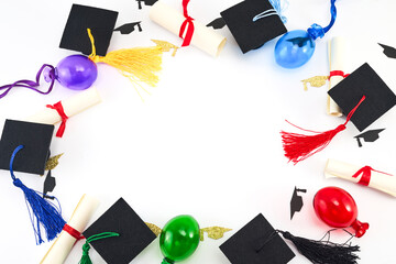 Graduation Celebration Concept. Top view of graduation caps, diplomas, and colorful balloons on white.
