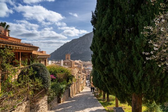 view of the famous Calvari Steps and the historic mountain town of Pollenca in northern Mallorca