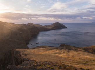 Cape Ponta de Sao Lourenco, Canical, East coast of Madeira Island, Portugal. Scenic volcanic landscape of Atlantic Ocean, rocks and cllifs and cloudy sunrise sky. Views from popular hiking trail PR8