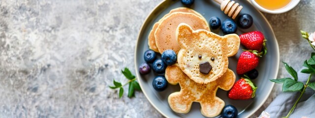 Fototapeta premium baby pancakes with honey and berries. Selective focus